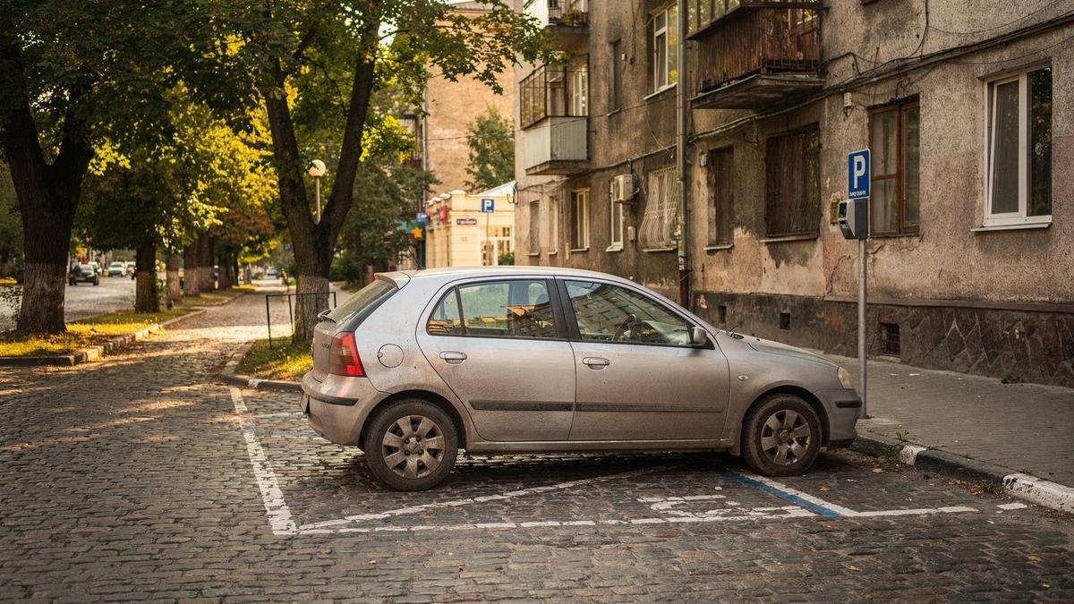 A compact rental car parked on a quiet Kyiv side street in morning light